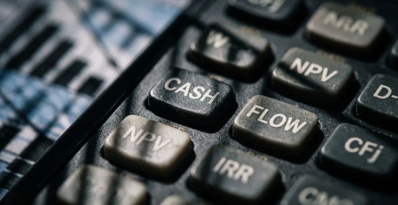 Extreme close-up of financial calculator keys and cash flow patterns
