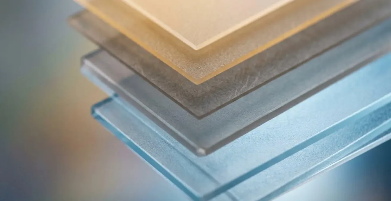 Macro view of layered transparent materials representing different subscription cost categories with visible depth and texture